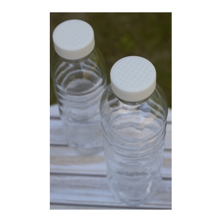 two_pure_bottle_white_flower_of_life_on_table_outside_bioplastic_lid_500ml_natures_design_serenity_plus_1580088495
